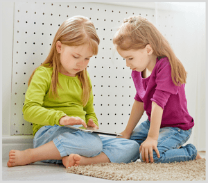 Two children playing with a tablet on the Internet